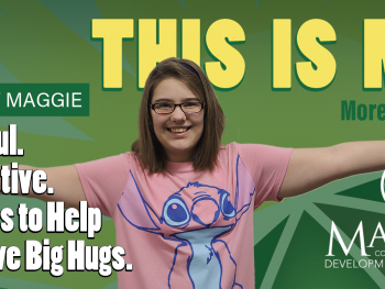 Maggie giving air hugs on a billboard.