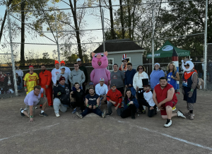 Kickball Teams pose for a picture after the game